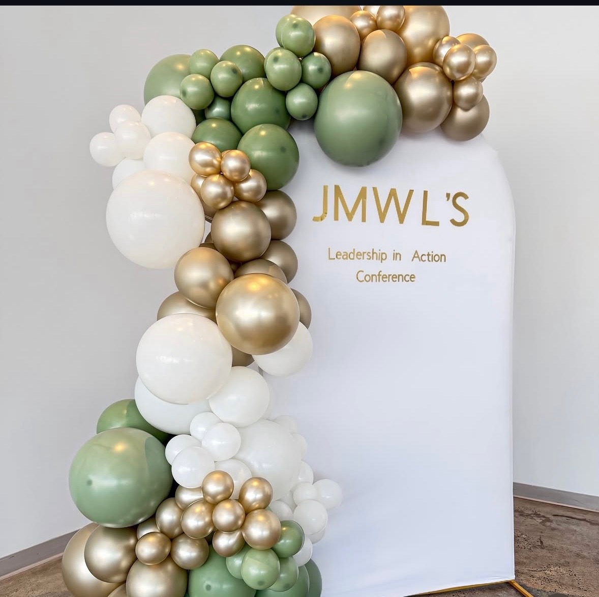 Sage green, gold and white balloon arch backdrop