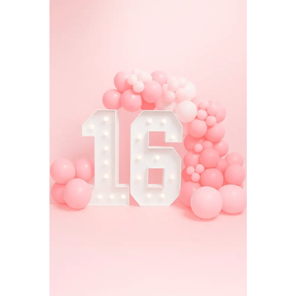 Illuminated marquee number 16 with pink balloon garland