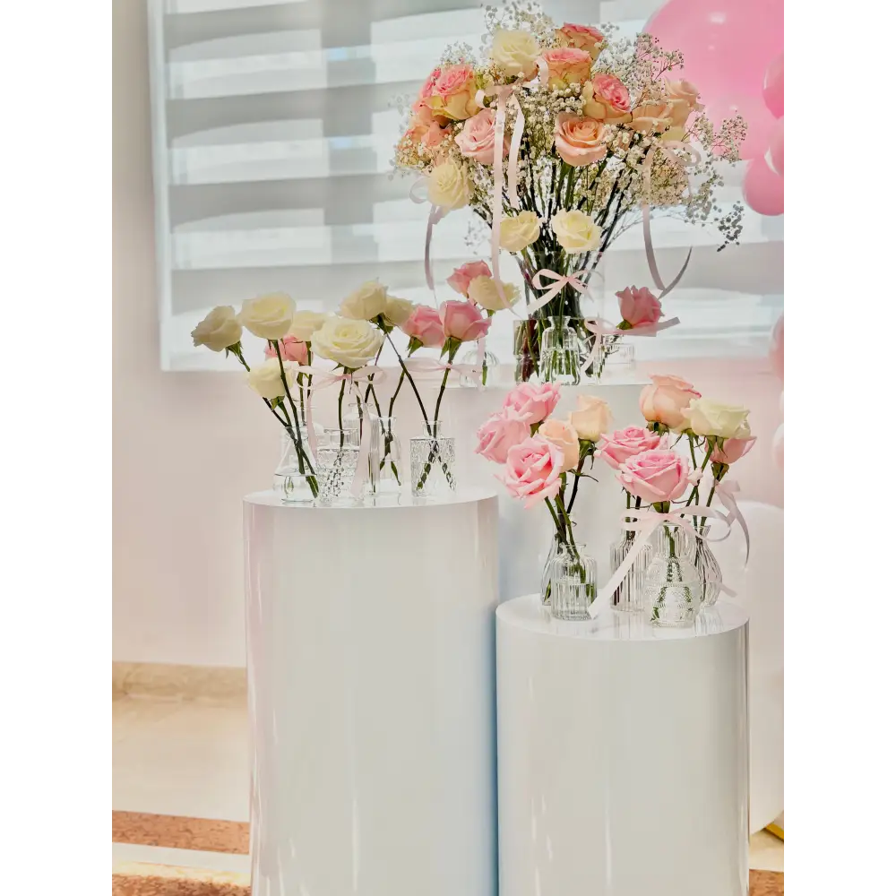 Cylinder pedestals with romantic floral arrangements